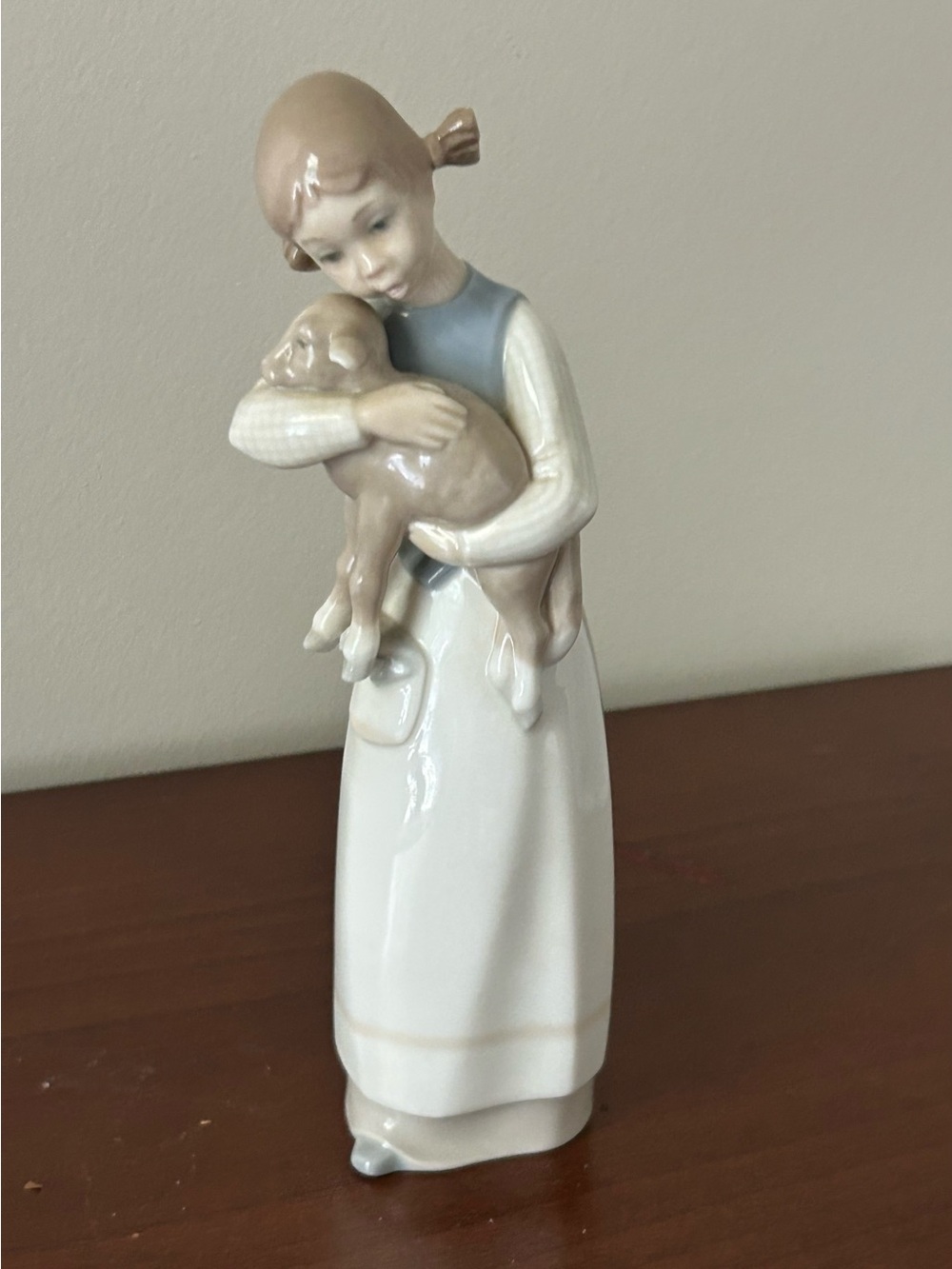 Lladro "Girl with Lamb" (#1010) glossy porcelain figurine.